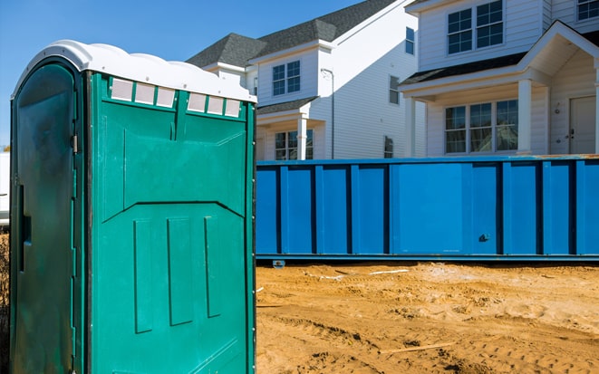 dumpster and portable toilet at a construction site in reno nv